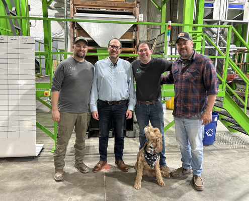 Eric Wenberg with employees of the Pence Group.