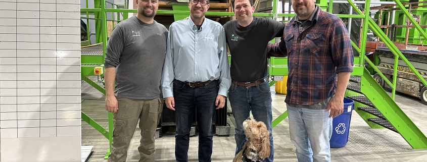 Eric Wenberg with employees of the Pence Group.