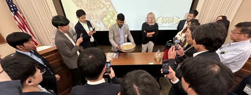 Participants at the NCI IP/Food Grade Soybean Procurement course watch a soybean grading demonstration